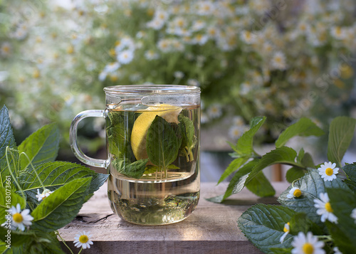 Herbal tea with fresh herbs I chamomile, mint and lemon.