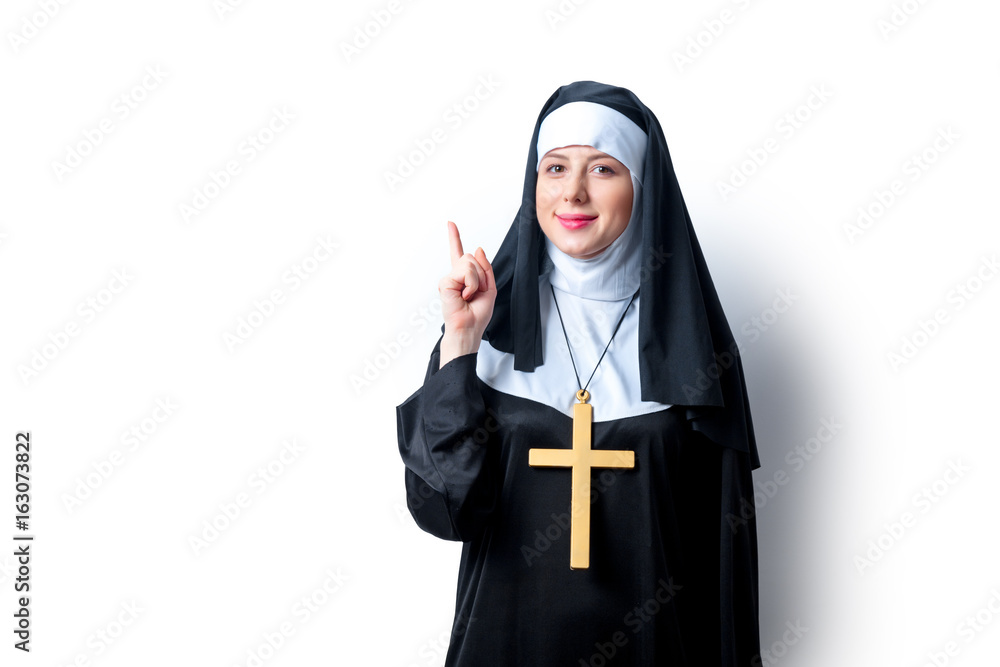 Young smiling nun with cross