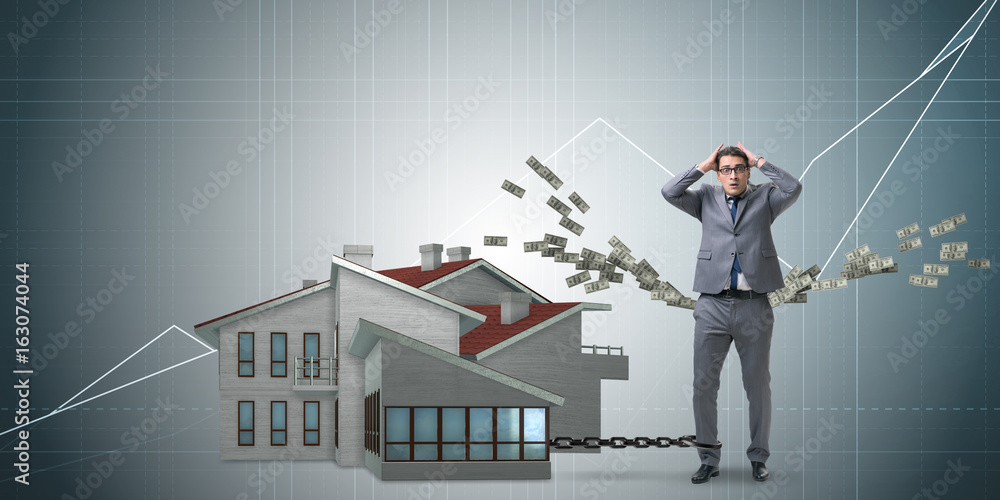 Businessman in mortgage debt financing concept Businessman in mortgage debt financing concept