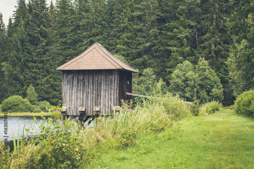 lake dwelling in idyllic landscape lake dwelling in idyllic landscape