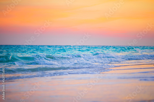 Amazing beautiful sunset on an exotic caribbean seashore