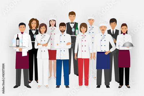 Hotel restaurant team concept in uniform. Group of catering characters standing together chef, cook, waiters and barman.