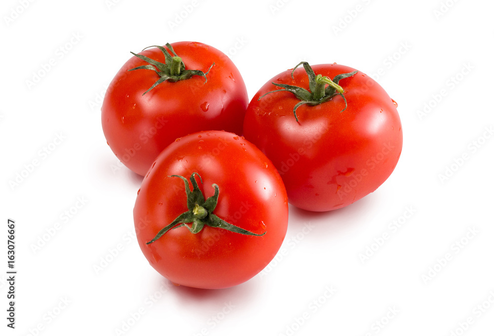 Red fresh tomatoes on a white isolated background Red fresh tomatoes on a white isolated background