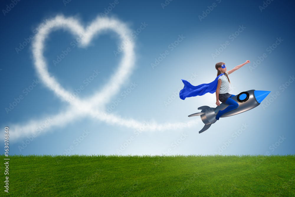Little girl flying rocket in superhero concept Little girl flying rocket in superhero concept