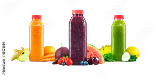 Three Bottles of Freshly Squeezed Fruit and Vegetable Juice on White Background