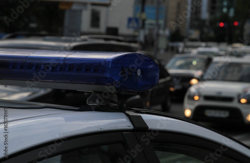 Slika na platnu Police car with lights turned on