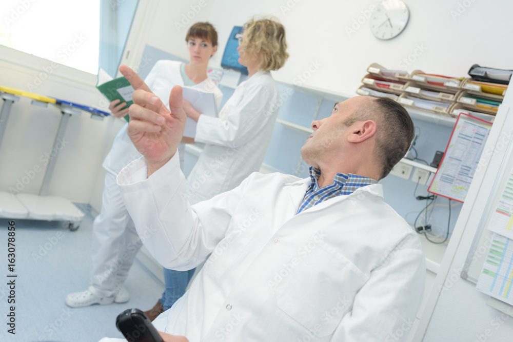 doctor talking to nurses doctor talking to nurses