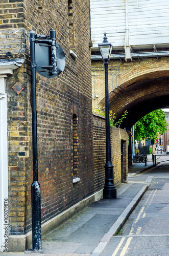 Typical English architecture, residential buildings in a row along the street photo