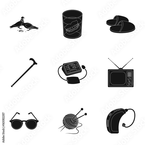 Armchair, slippers, tonometer and other attributes of old age.Old age set collection icons in black style vector symbol stock illustration web.
