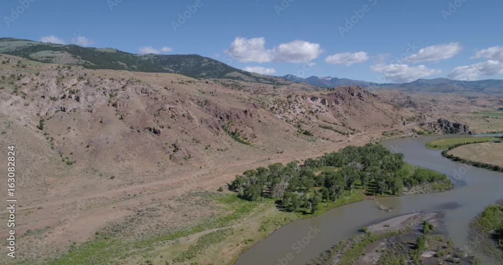 Aerial view of a dirt road and river 4k 24fps Aerial view of a dirt road and river 4k 24fps