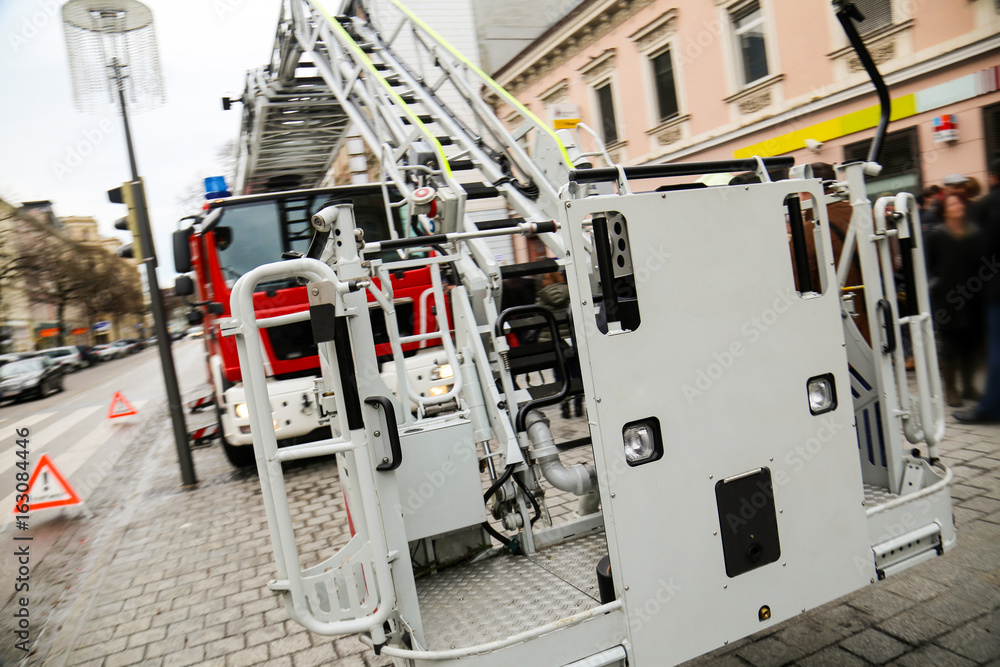 Firetruck on a city street, close-up view of ladder lift
