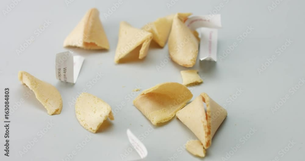 full of broken fortune cookies table and new ones falling on