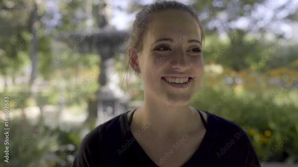 Portrait Of Smiling Ballerina, She Stands In Front Of Fountain In Park (Slow Motion) Portrait Of Smiling Ballerina, She Stands In Front Of Fountain In Park (Slow Motion)
