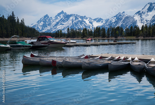 Kyaks in the marina below the mountains photo