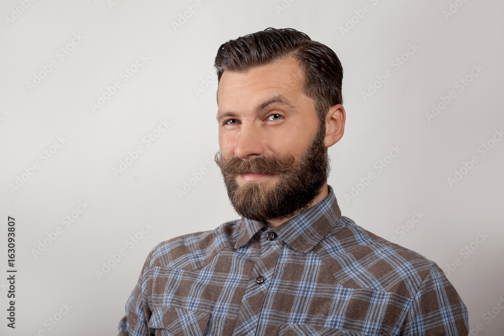 portrait of a young man with a beard and mustache portrait of a young man with a beard and mustache