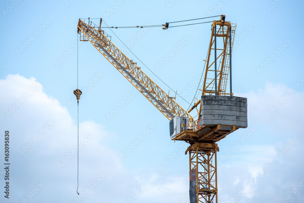 Construction crane. Rear part of construction crane. Concrete weights.