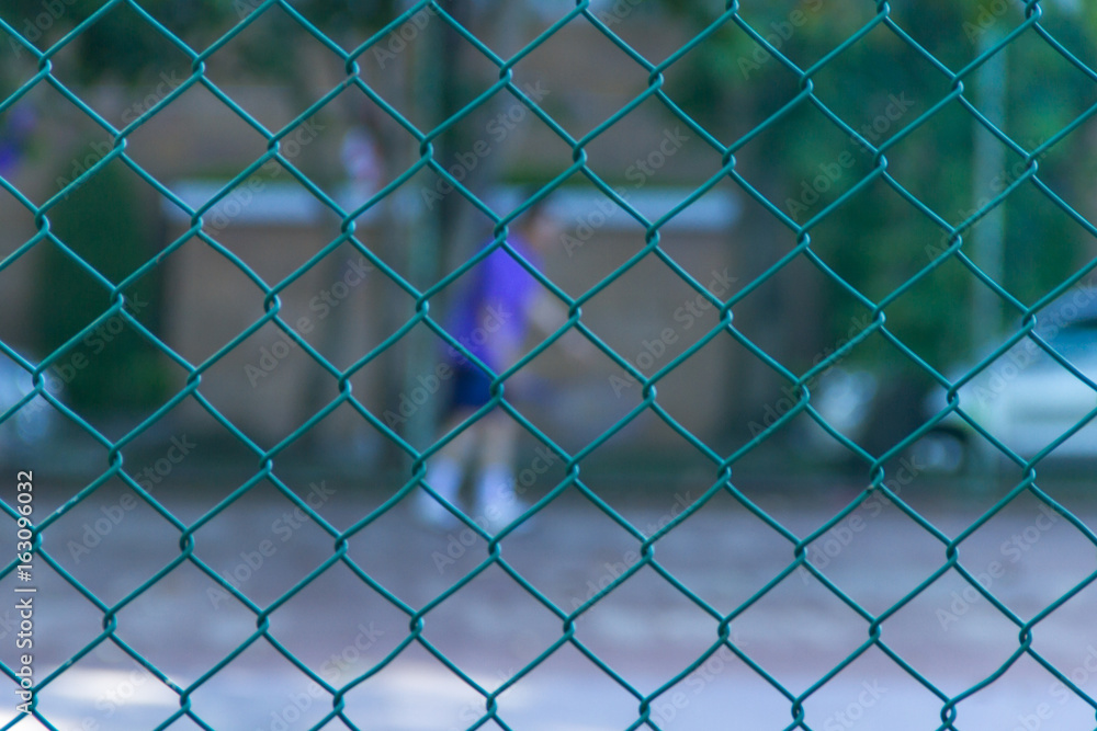 Defocus and blur image of tennis court with tennis player for background usage Defocus and blur image of tennis court with tennis player for background usage