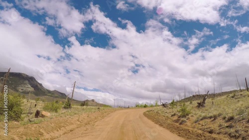 POV point of view -Dirt road in after forest fire area in the mountains near the Cheesman Lake in Colorado photo