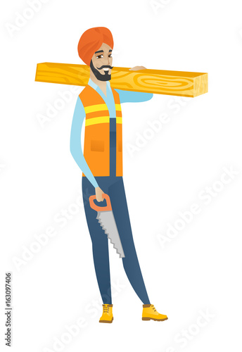Young hindu carpenter holding saw and wooden board