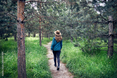 Beautiful woman walking in the forest © pikoso.kz