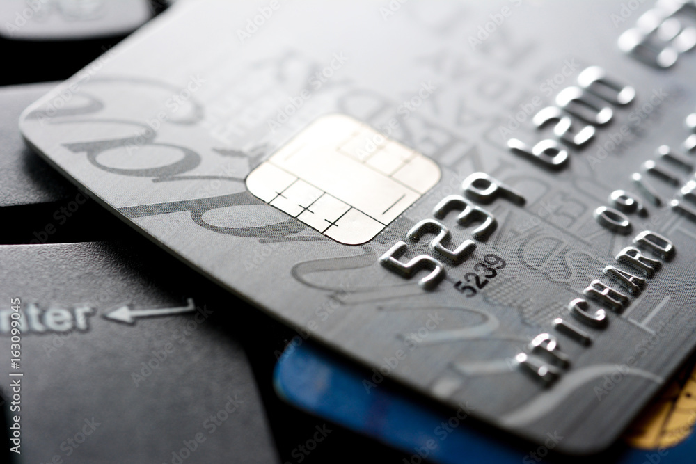 Close up of credit card with chip and numbers Close up of credit card with chip and numbers