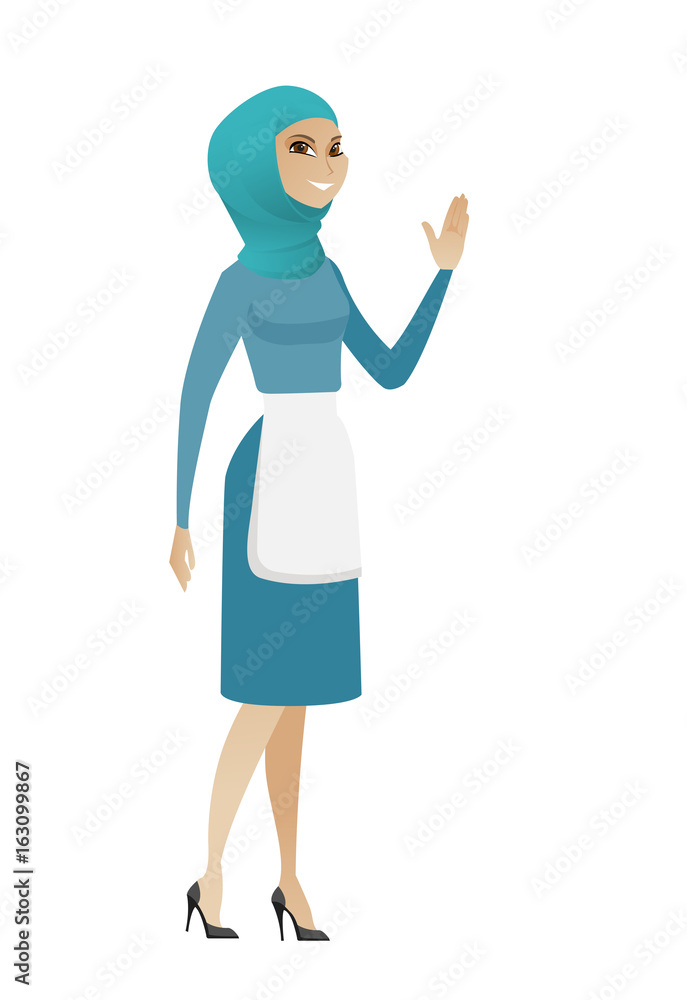 Young muslim cleaner waving her hand. Young muslim cleaner waving her hand.