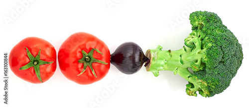 Fresh vegetables broccoli, onion and tomatoes isolated on white background. Top view.