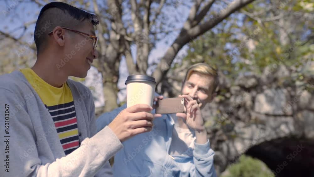 Man Takes Photo Of His Boyfriend With His Coffee Cup, Then Takes Photo Of Landscape Man Takes Photo Of His Boyfriend With His Coffee Cup, Then Takes Photo Of Landscape