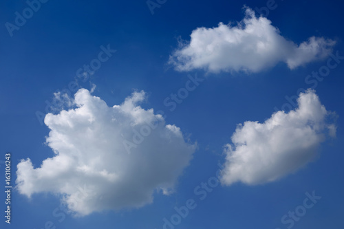 fluffy cloud on clear blue sky