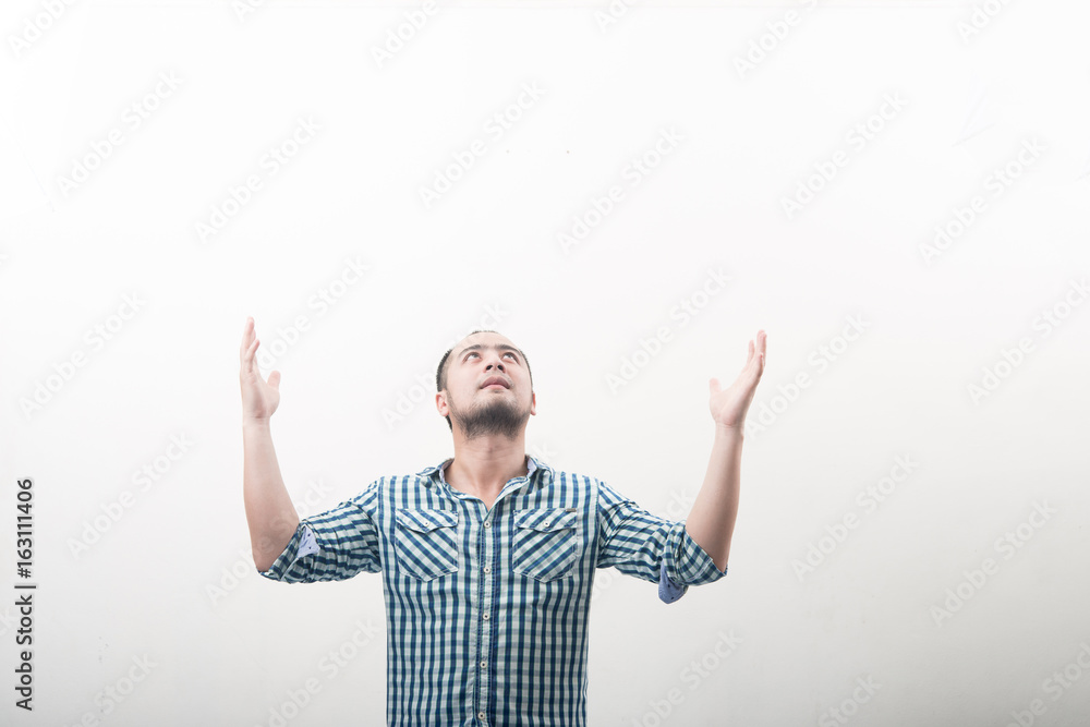 Portrait of young handsome man hands up isolated on white background. Portrait of young handsome man hands up isolated on white background.