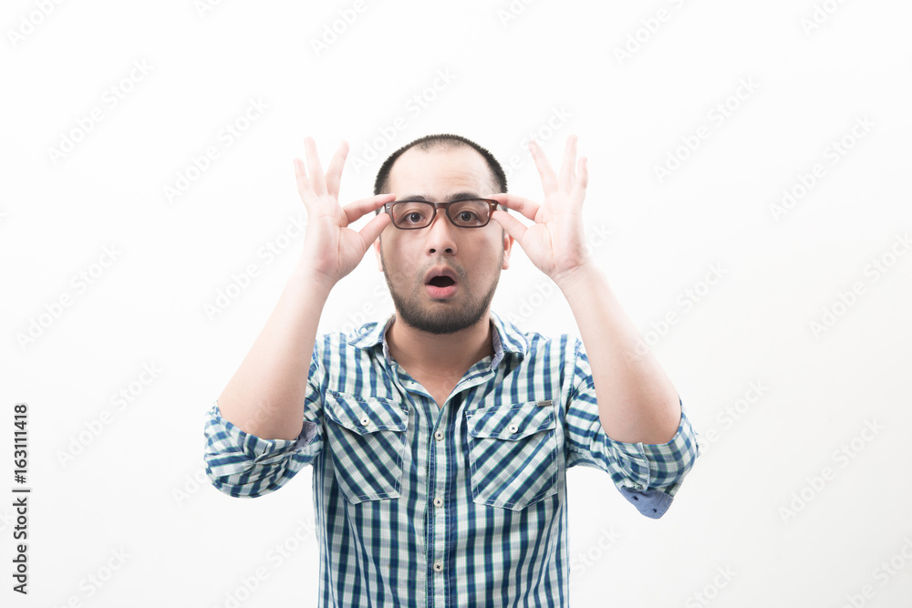 Naklejka premium Portrait of young handsome man isolated on white background touching his glasses.