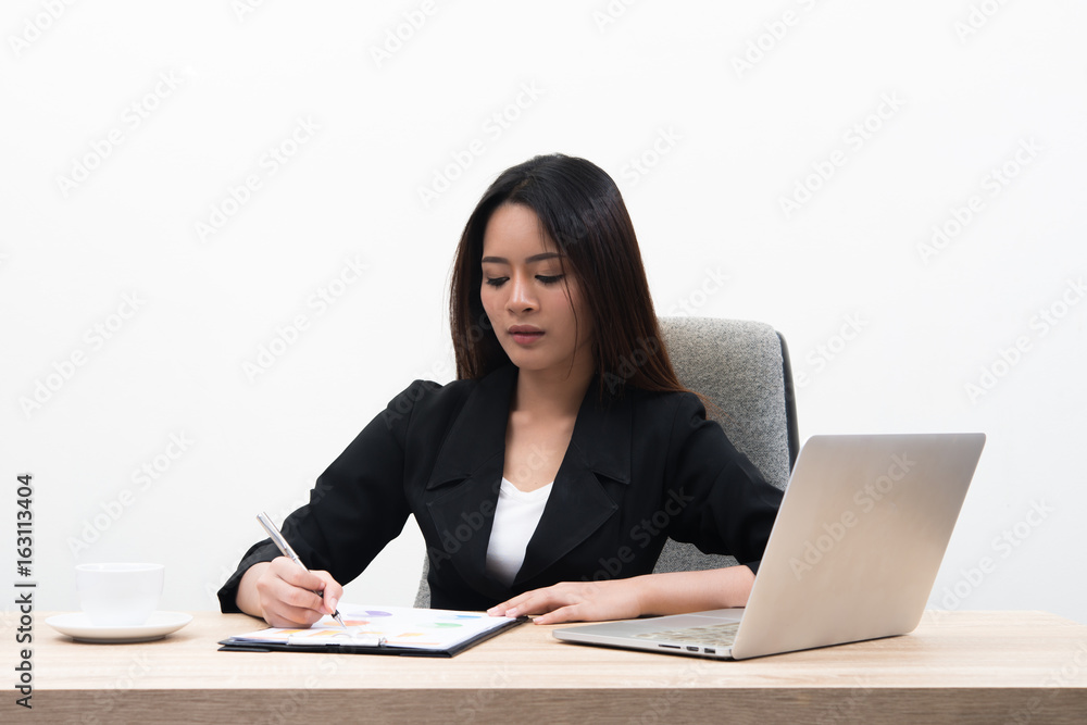 Young asian pretty business woman with notebook in the office isolated on white background. Young asian pretty business woman with notebook in the office isolated on white background.