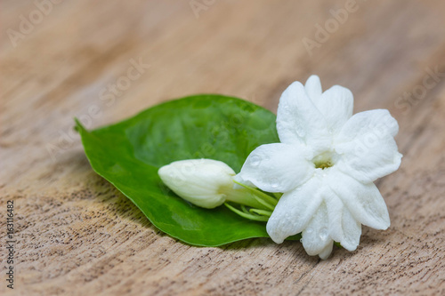 Jasmine flowers on wooden background  soft focus