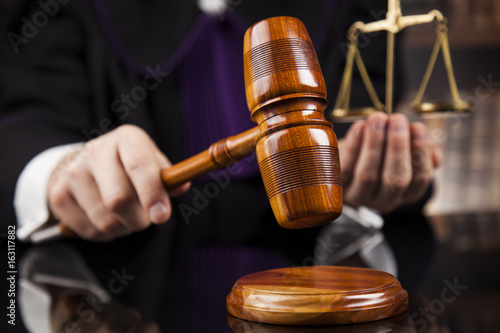 Law and justice concept, Brown wooden background, beautiful reflections photo