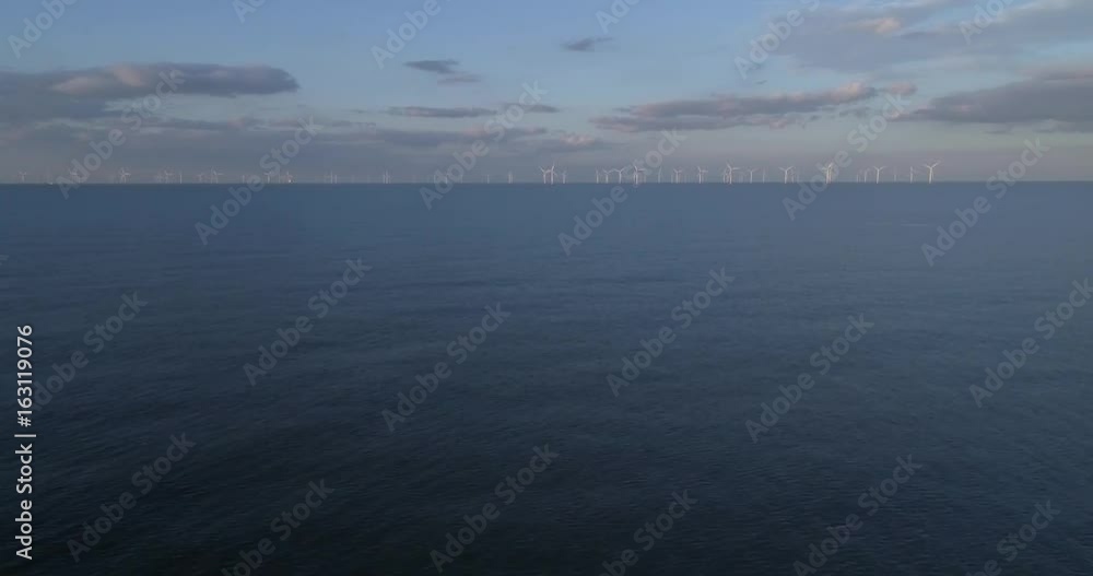 Aerial view of offshore wind farm, green energy, renewable
