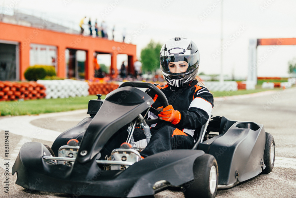 Woman driving go-cart Woman driving go-cart