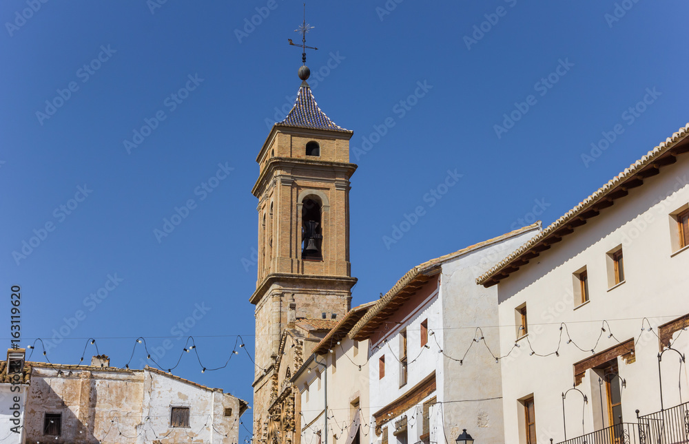 Church tower and white houses at the central square of Requena