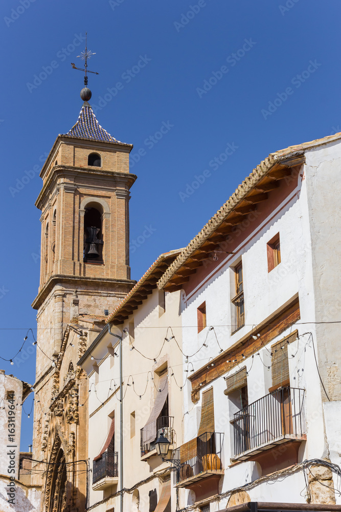 Church tower and white houses at the central square of Requena