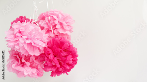 Paper flowers at the girl baby shower party.  Baby shower celebration concept