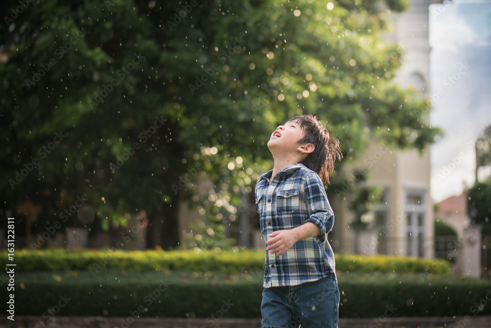 Cute Asian child looking up