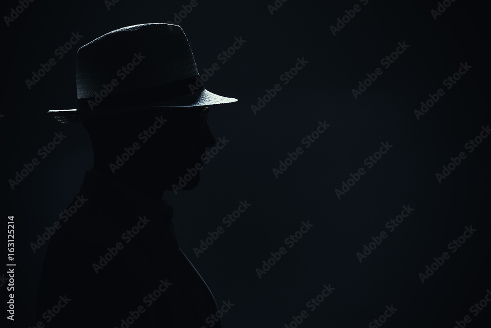 Silhouette of a Man With Hat