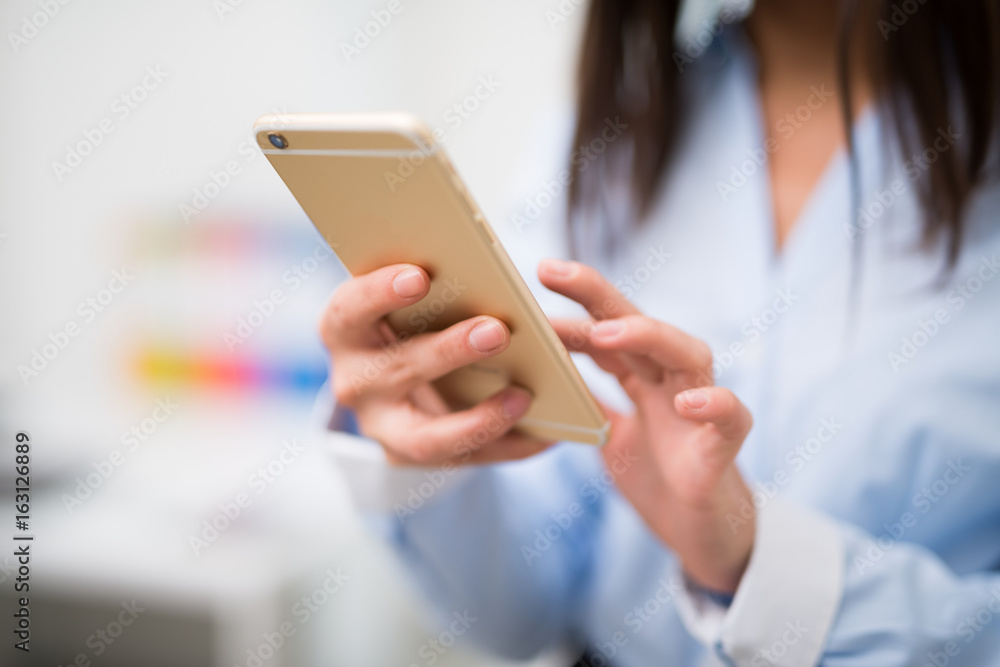 Woman using her mobile phone Woman using her mobile phone