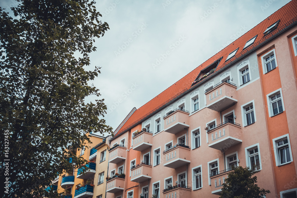 Naklejka premium rose facaded building with balconies
