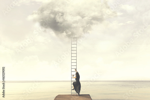 Fotografie Surreal moment of woman climbing an imaginary scale to the clouds