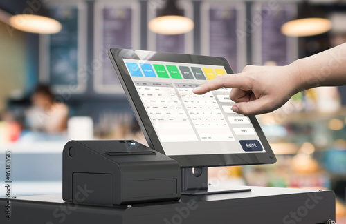hand working cashier machine photo