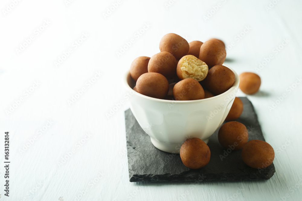 Sweet marzipan potatoes in white bowl Sweet marzipan potatoes in white bowl