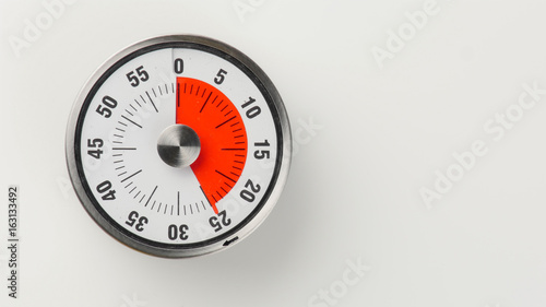 Vintage analog kitchen countdown timer, 25 minutes remaining