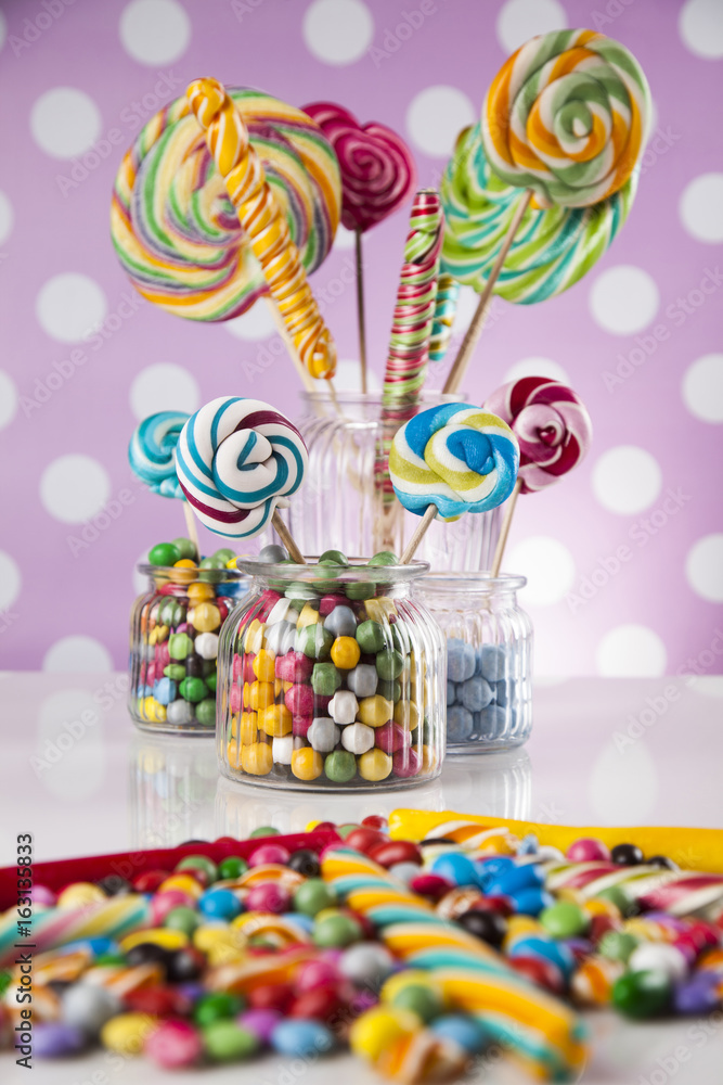 Candies including lollipops, gum balls