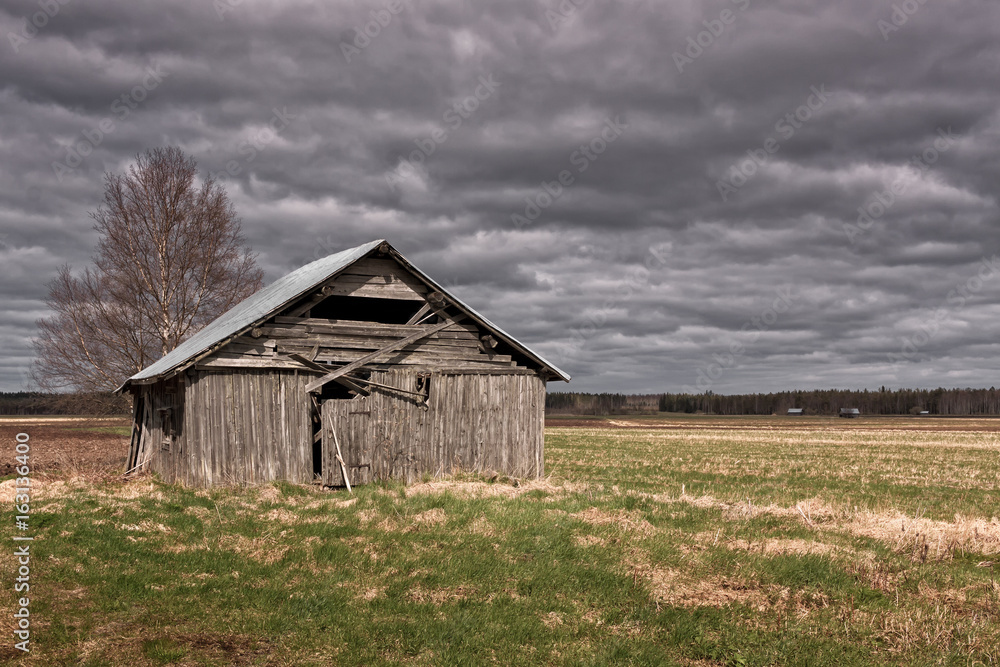 Rain Clouds Over The Old Barn House
