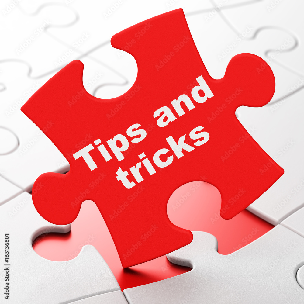 Education concept: Tips And Tricks on puzzle background Education concept: Tips And Tricks on puzzle background